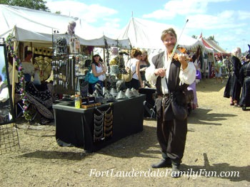 A fiddler playing his instrument at the Renaissance festival.