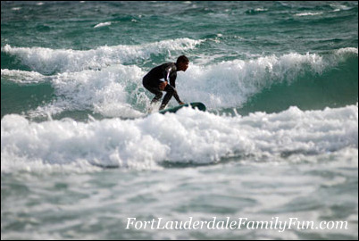 Surfing the waves at Deerfield Beach