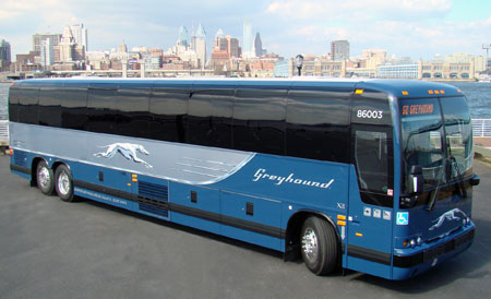 A grey and blue Greyhound bus.