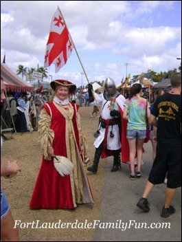 Renaissance Festival performers as a lady and her brave knight.
